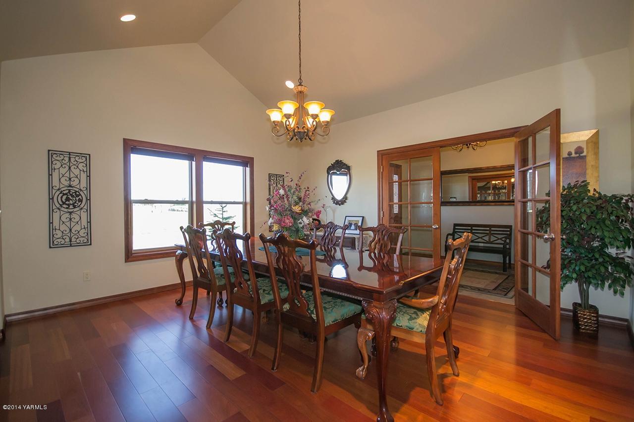 10600 Occidental Road Yakima, WA 98903 - Photo 12 of 40 a view of a dining room with furniture window and wooden floor