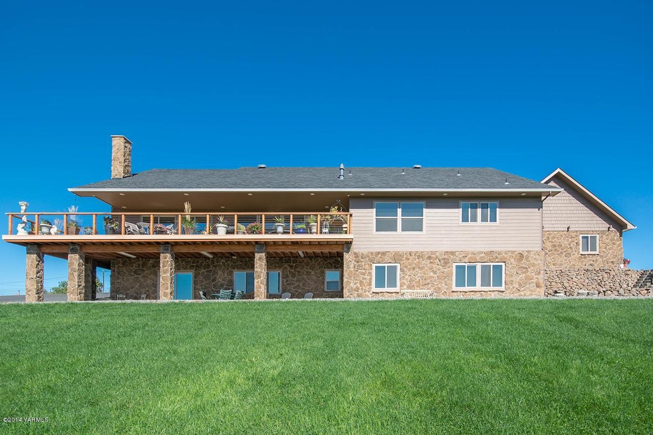 10600 Occidental Road Yakima, WA 98903 - Photo 35 of 40 a front view of a house with a yard and balcony