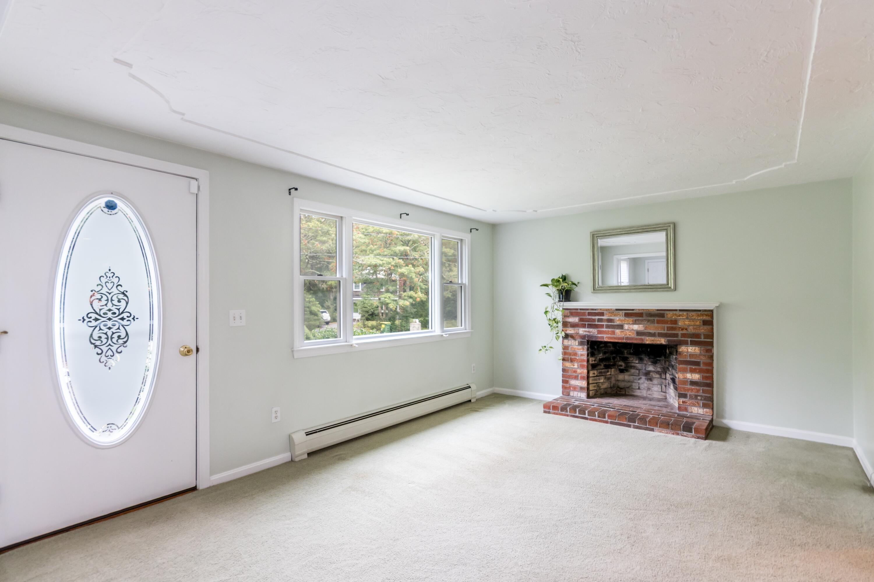65 Bosuns Way Marstons Mills, MA 02648 - Photo 13 of 38 Living room with fireplace
