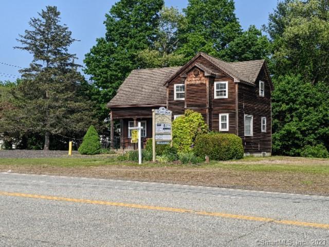 126 Storrs Road Mansfield, CT 06250 - Photo 1 of 1 a front view of a house with a yard and garage