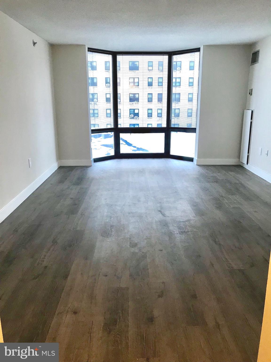 2020 Walnut Street, Unit 10J Philadelphia, PA 19103 - Photo 1 of 18 a view of an empty room with a window