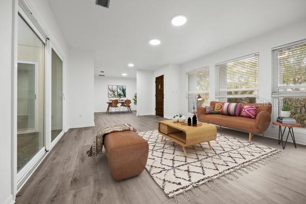 6002 Northwest 33 Street Gainesville, FL 32653 - Photo 13 of 29 a living room with furniture and a large window