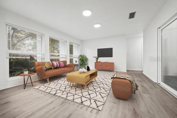 6002 Northwest 33 Street Gainesville, FL 32653 - Photo 14 of 29 a living room with furniture and a flat screen tv