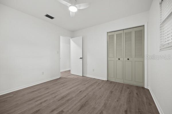 6002 Northwest 33 Street Gainesville, FL 32653 - Photo 22 of 29 a view of an empty room with wooden floor