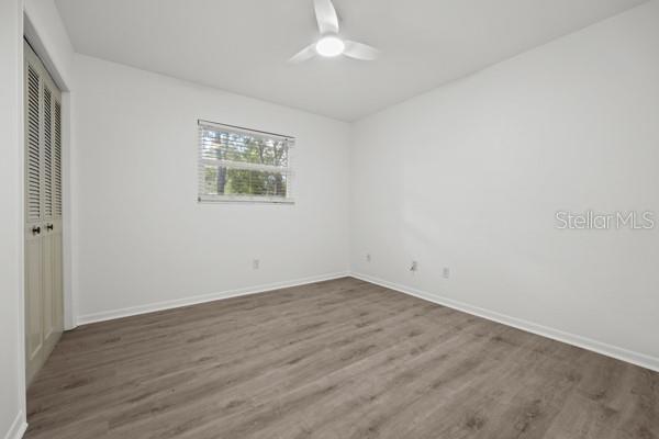 6002 Northwest 33 Street Gainesville, FL 32653 - Photo 23 of 29 wooden floor in an empty room with a window