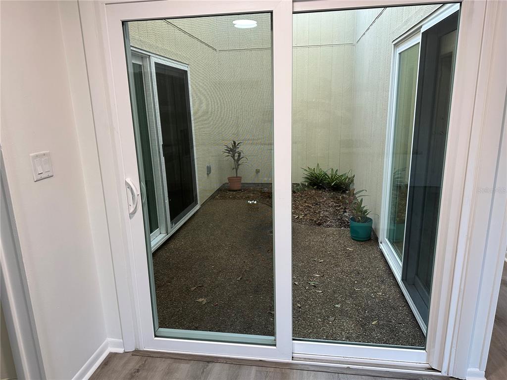 6002 Northwest 33 Street Gainesville, FL 32653 - Photo 8 of 29 an entryway with a glass door