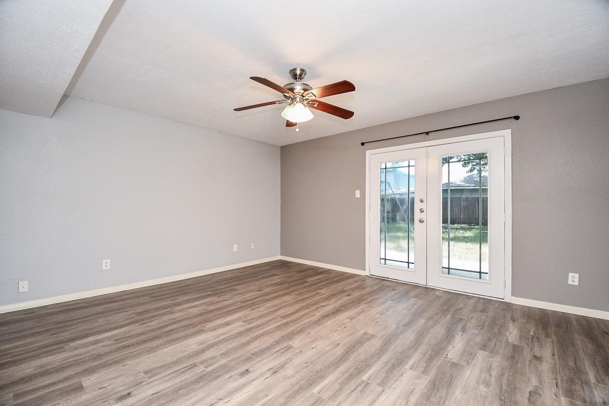 2331 Wren Meadow Road Richmond, TX 77406 - Photo 18 of 37 Welcome to your Primary Suite! Enjoy French doors with direct access to the back yard, high ceilings, neutral paint and floors, 2 closets and updated en suite bath!