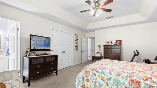 a bedroom with a bed and a dresser