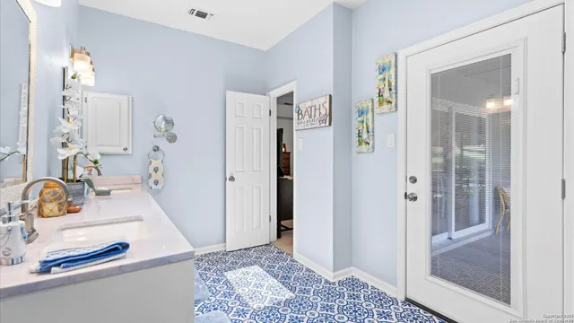 a bathroom with a sink and a mirror