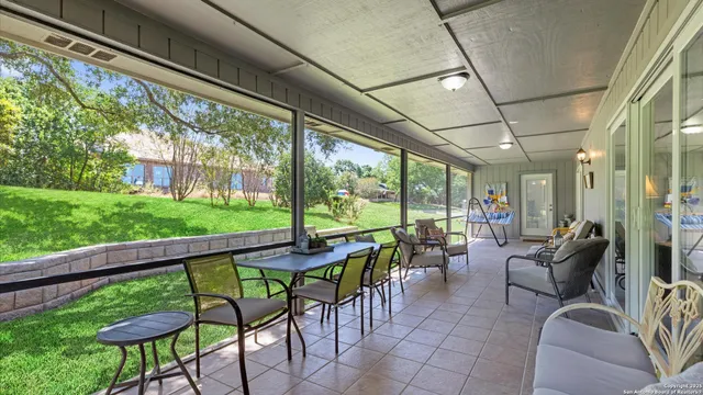 a room with furniture and a large window