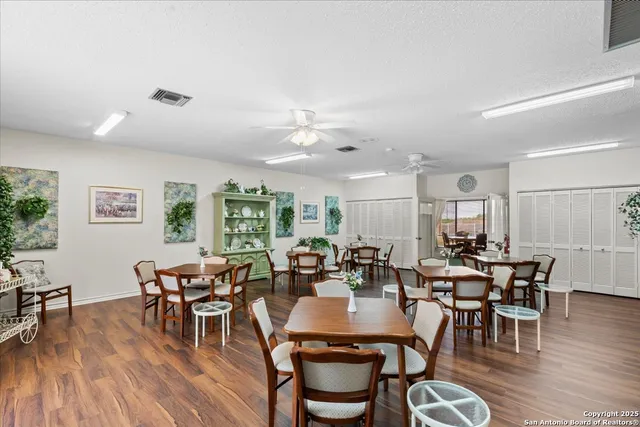 a view of a living room and kitchen with furniture