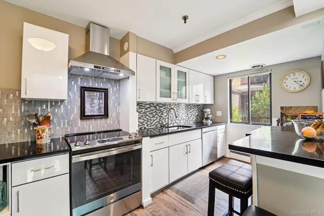 a kitchen with a stove and a sink