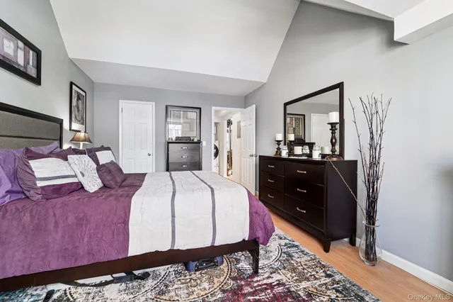 a bed room with a bed and a mirror