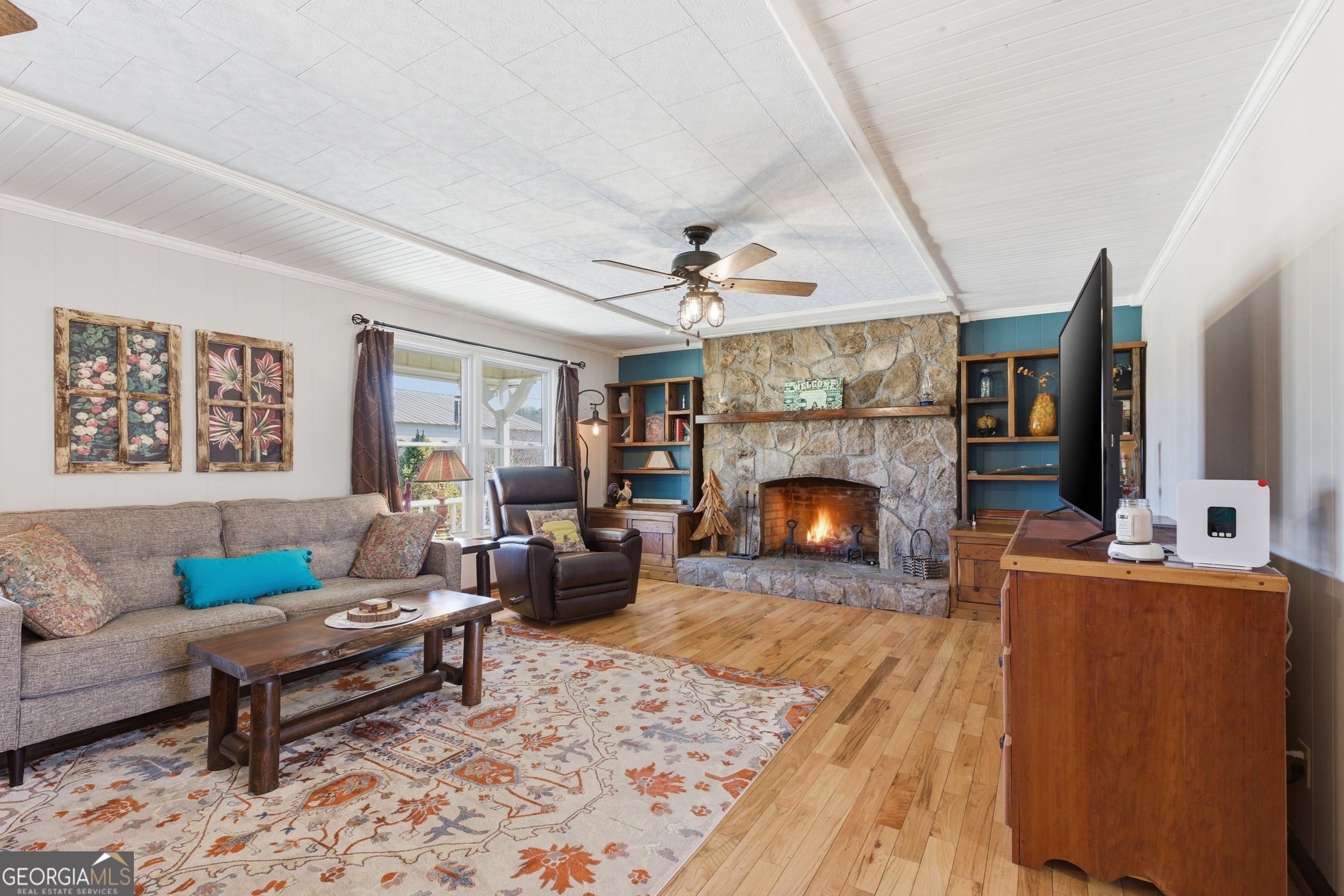 190 Legendary Lane Rabun Gap, GA 30568 - Photo 18 of 47 a living room with furniture and a fireplace