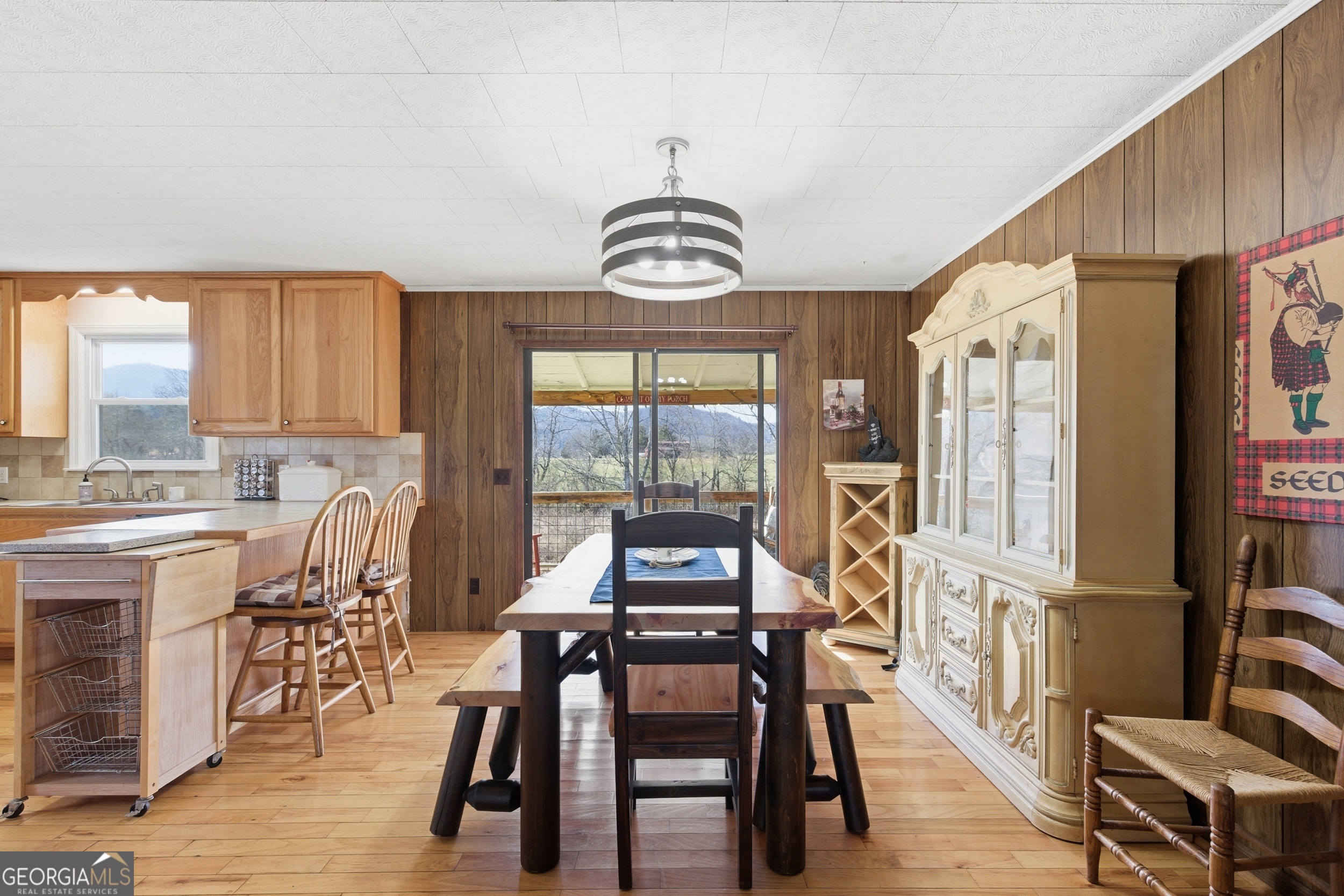 190 Legendary Lane Rabun Gap, GA 30568 - Photo 20 of 47 a view of a dining room with furniture window and wooden floor