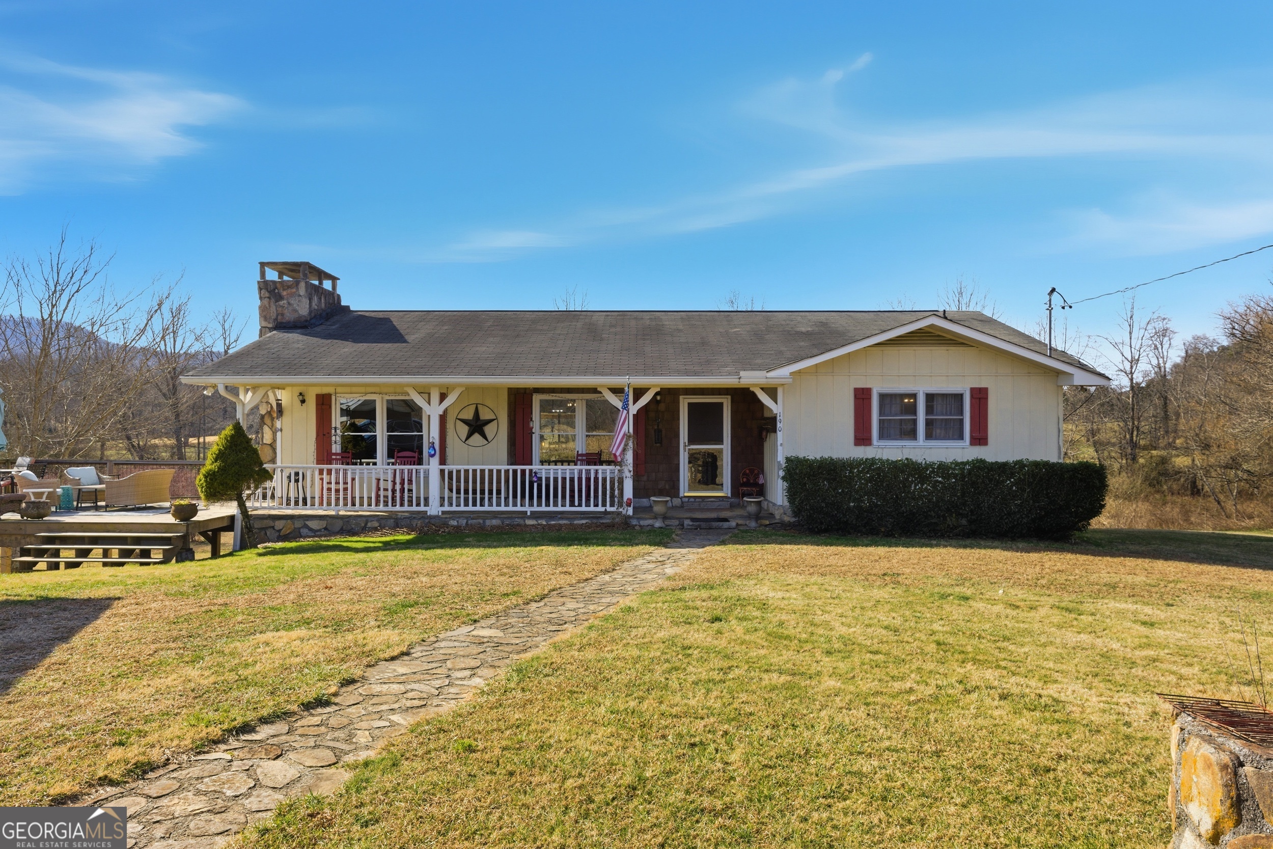 190 Legendary Lane Rabun Gap, GA 30568 - Photo 2 of 47 a front view of house with yard and swimming pool