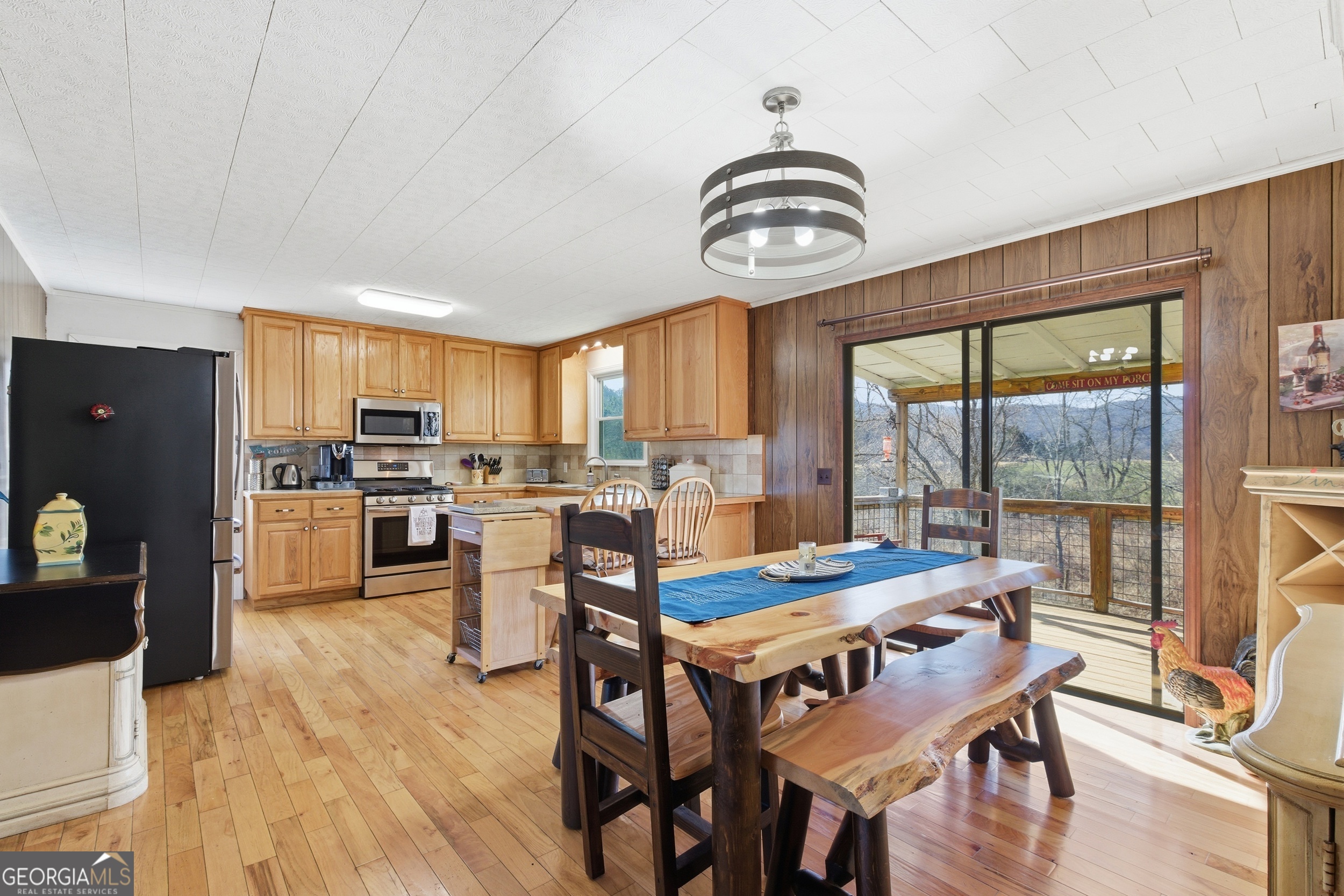 190 Legendary Lane Rabun Gap, GA 30568 - Photo 21 of 47 a view of a dining room with furniture window and wooden floor