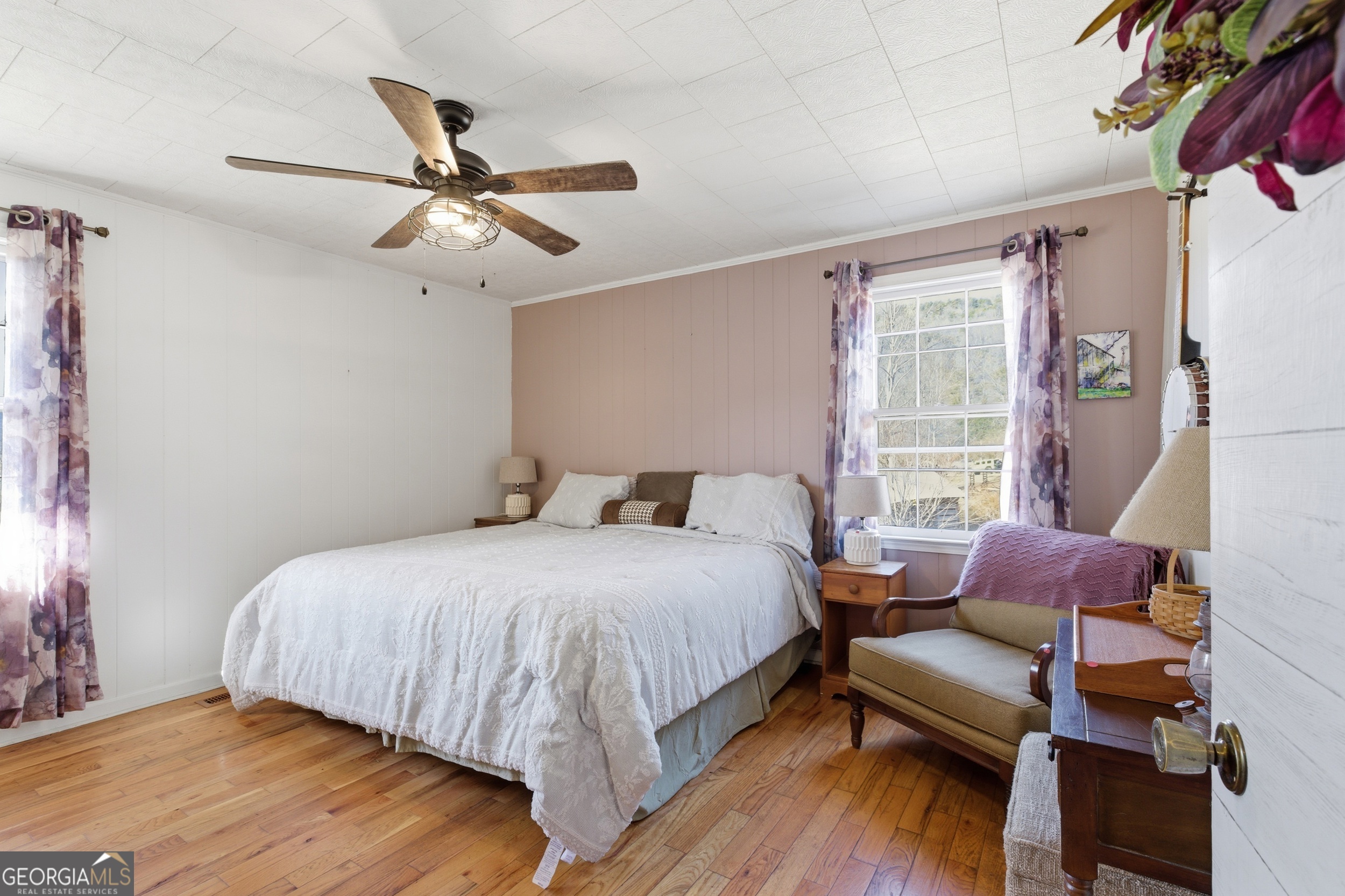 190 Legendary Lane Rabun Gap, GA 30568 - Photo 31 of 47 a bedroom with a bed couch and a window