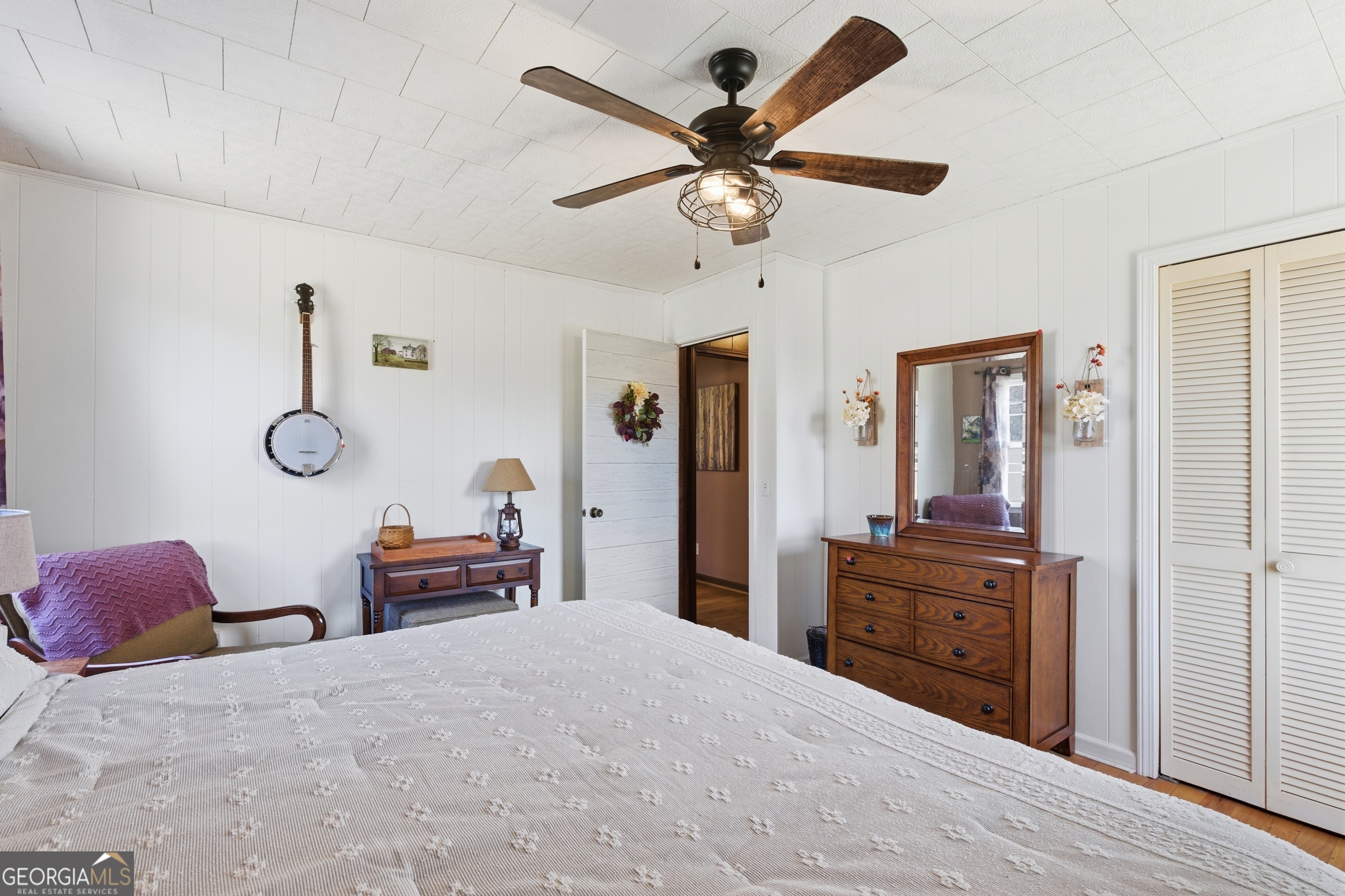 190 Legendary Lane Rabun Gap, GA 30568 - Photo 32 of 47 a bed room with a bed and a chandelier