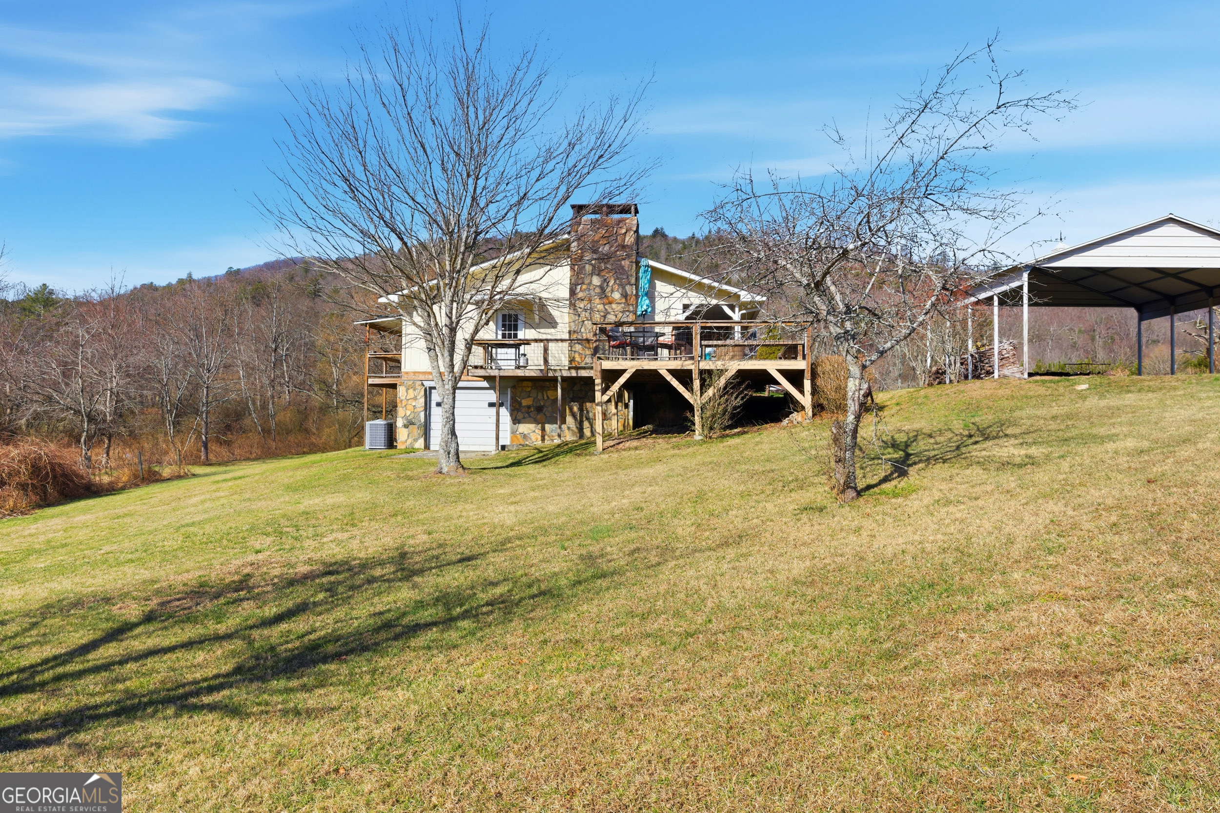 190 Legendary Lane Rabun Gap, GA 30568 - Photo 43 of 47 a view of a large house with a big yard