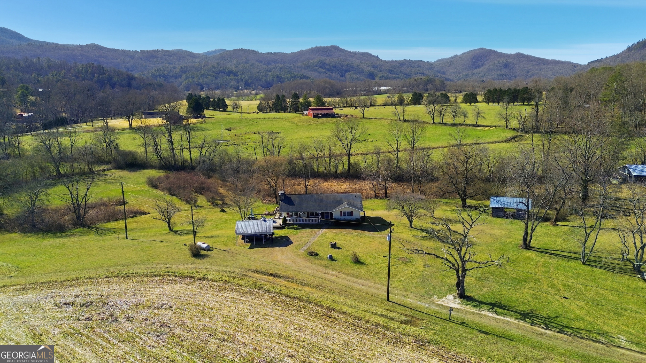 190 Legendary Lane Rabun Gap, GA 30568 - Photo 7 of 47 a view of a backyard with swimming pool and mountains