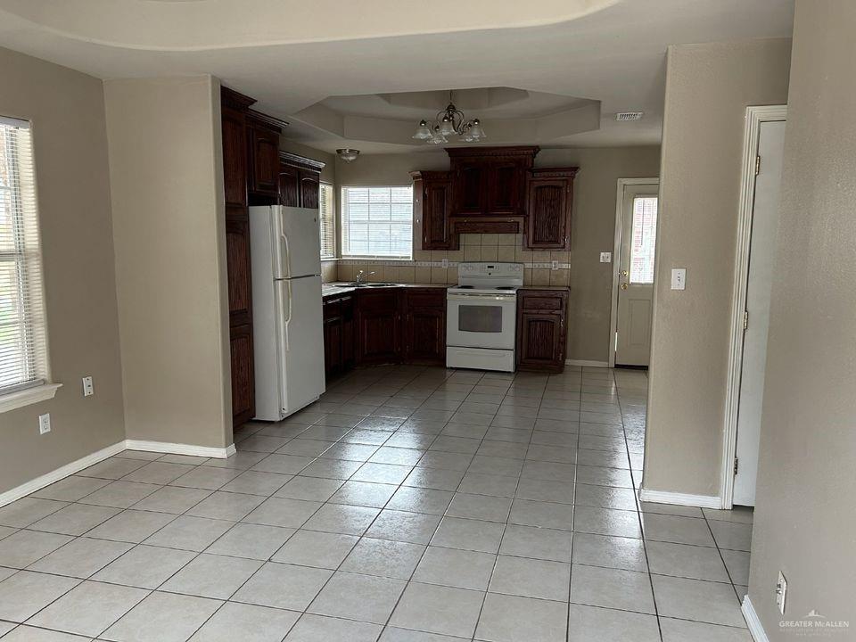 809 West Bronze Drive, Unit 1 Pharr, TX 78577 - Photo 13 of 13 a large kitchen with cabinets and stainless steel appliances