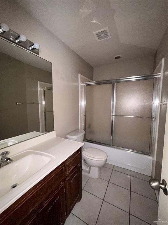 809 West Bronze Drive, Unit 1 Pharr, TX 78577 - Photo 3 of 13 a bathroom with a sink a toilet and shower