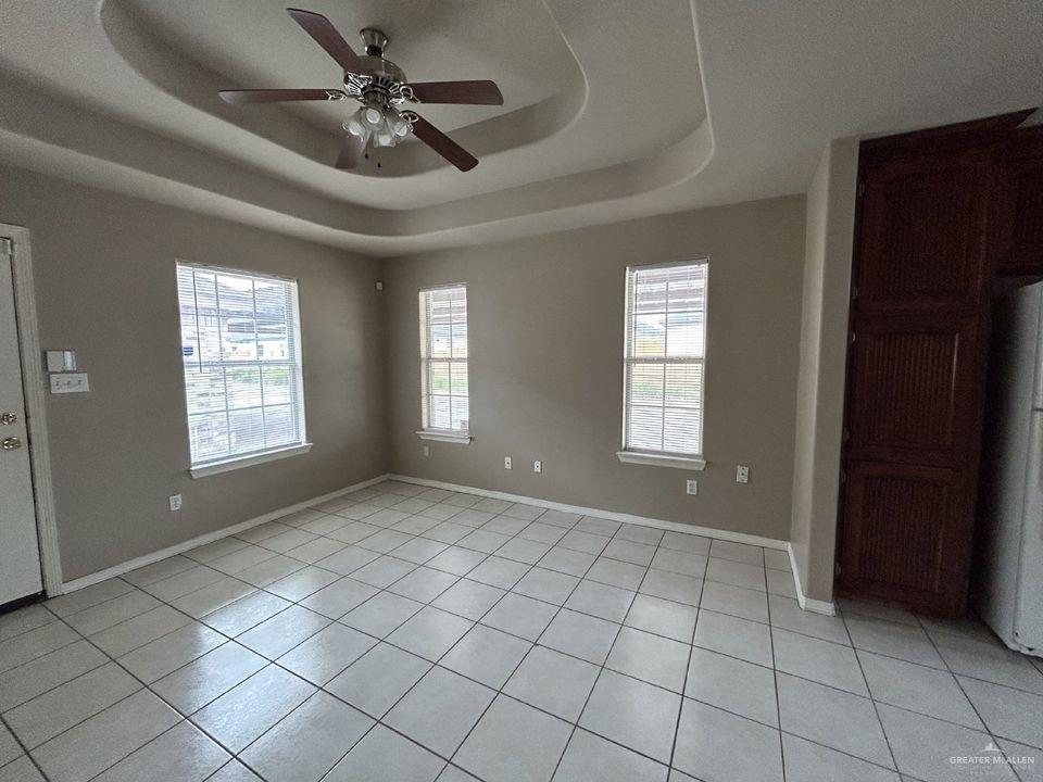 809 West Bronze Drive, Unit 1 Pharr, TX 78577 - Photo 4 of 13 a view of an empty room with window and chandelier fan
