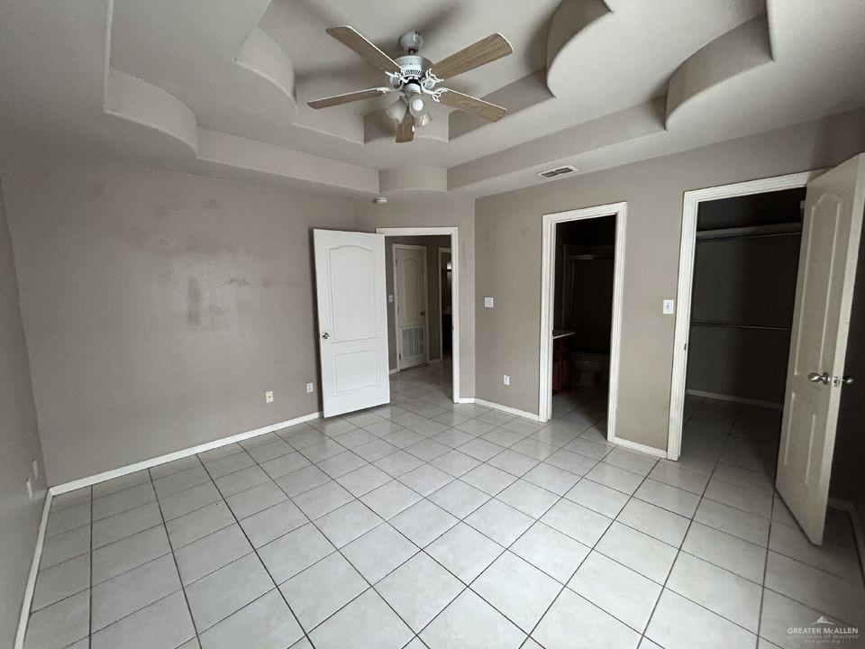 809 West Bronze Drive, Unit 1 Pharr, TX 78577 - Photo 7 of 13 an empty room with closet and ceiling fan