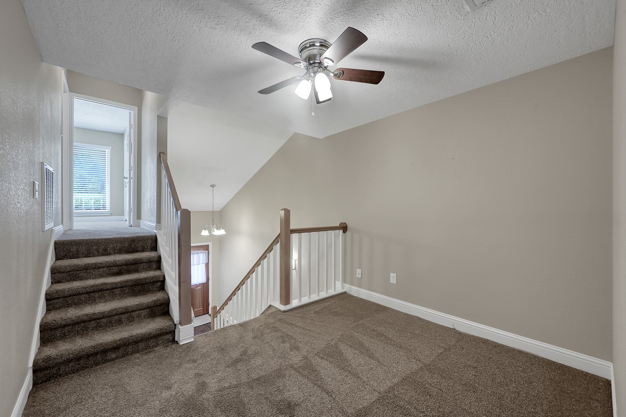 125 Capetown Street Conroe, TX 77356 - Photo 11 of 23 a view of an empty room with a ceiling fan
