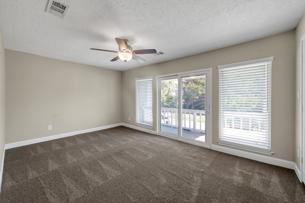 125 Capetown Street Conroe, TX 77356 - Photo 17 of 23 a view of an empty room with a window