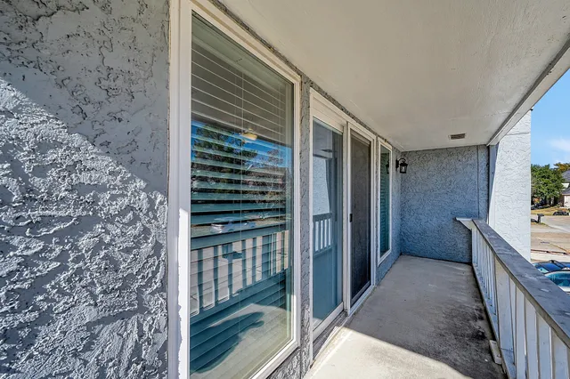 a view of balcony and yard