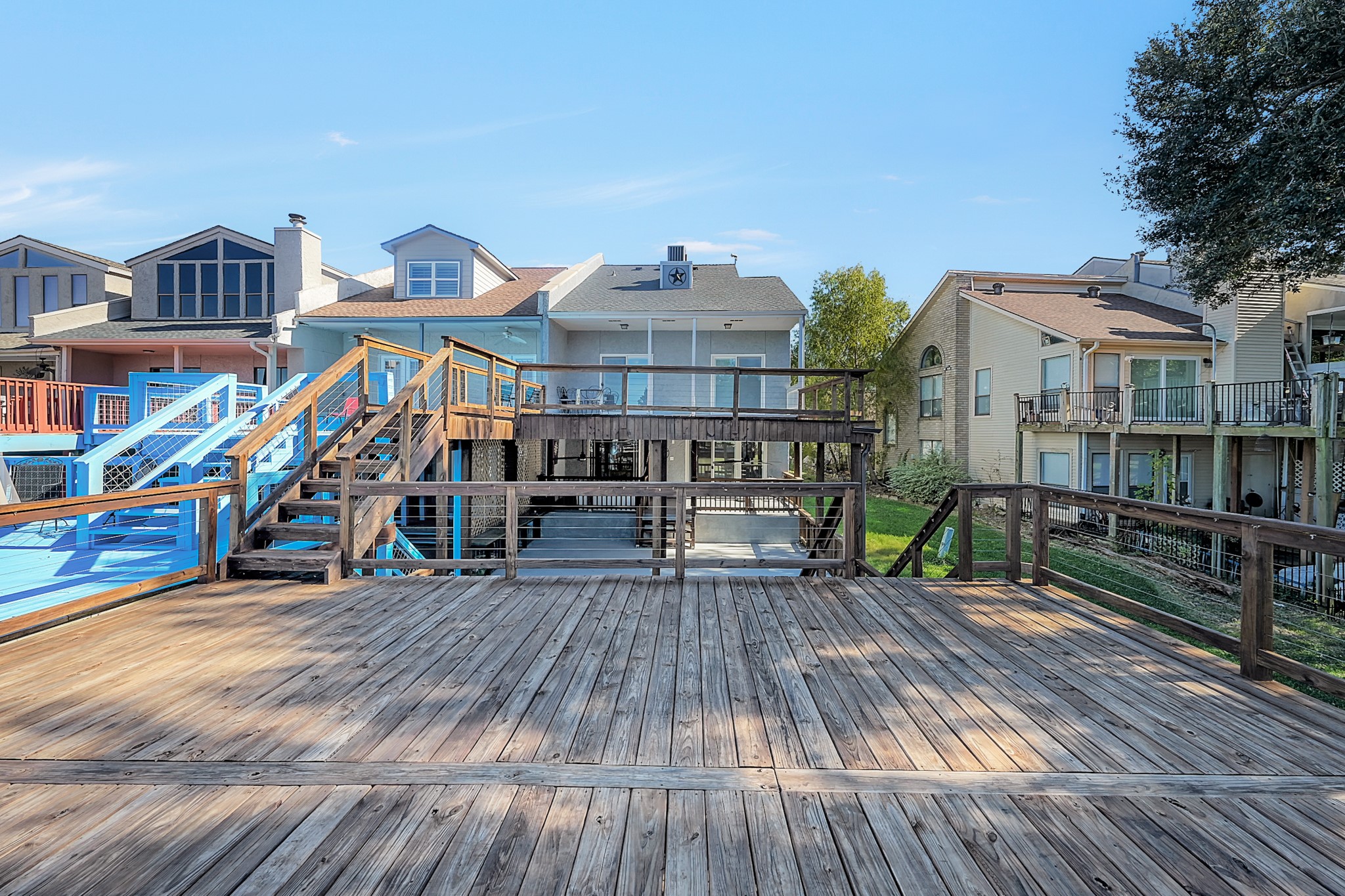 125 Capetown Street Conroe, TX 77356 - Photo 21 of 23 a view of a chairs and table on the wooden roof deck
