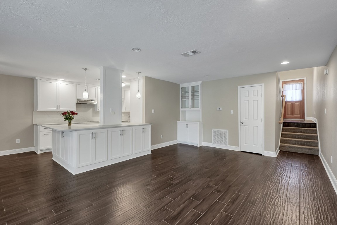 125 Capetown Street Conroe, TX 77356 - Photo 4 of 23 a view of kitchen with wooden floor and electronic appliances