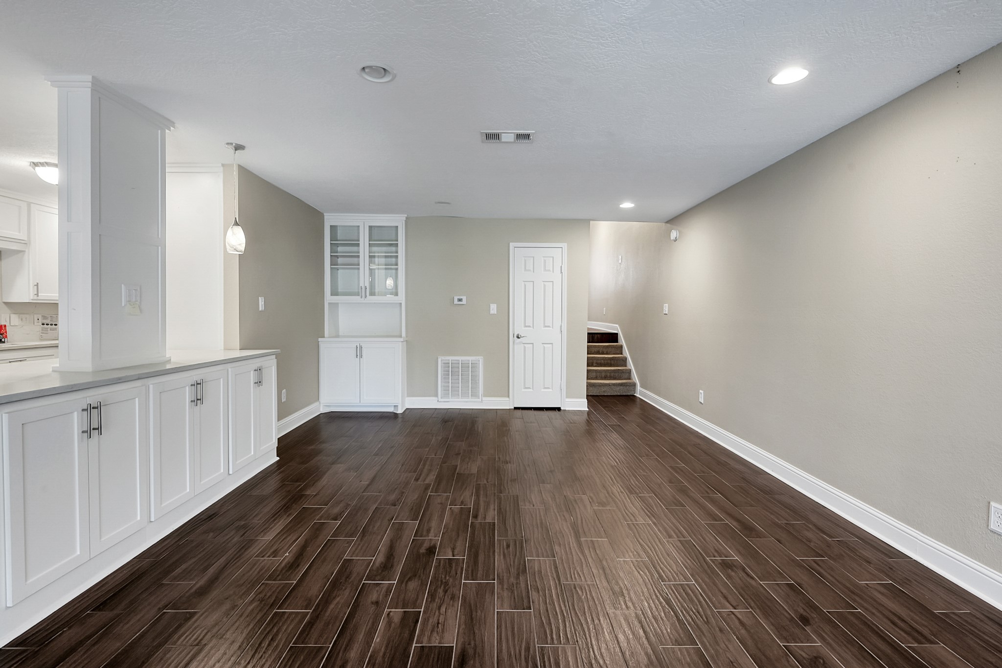125 Capetown Street Conroe, TX 77356 - Photo 5 of 23 a view of an empty room with wooden floor