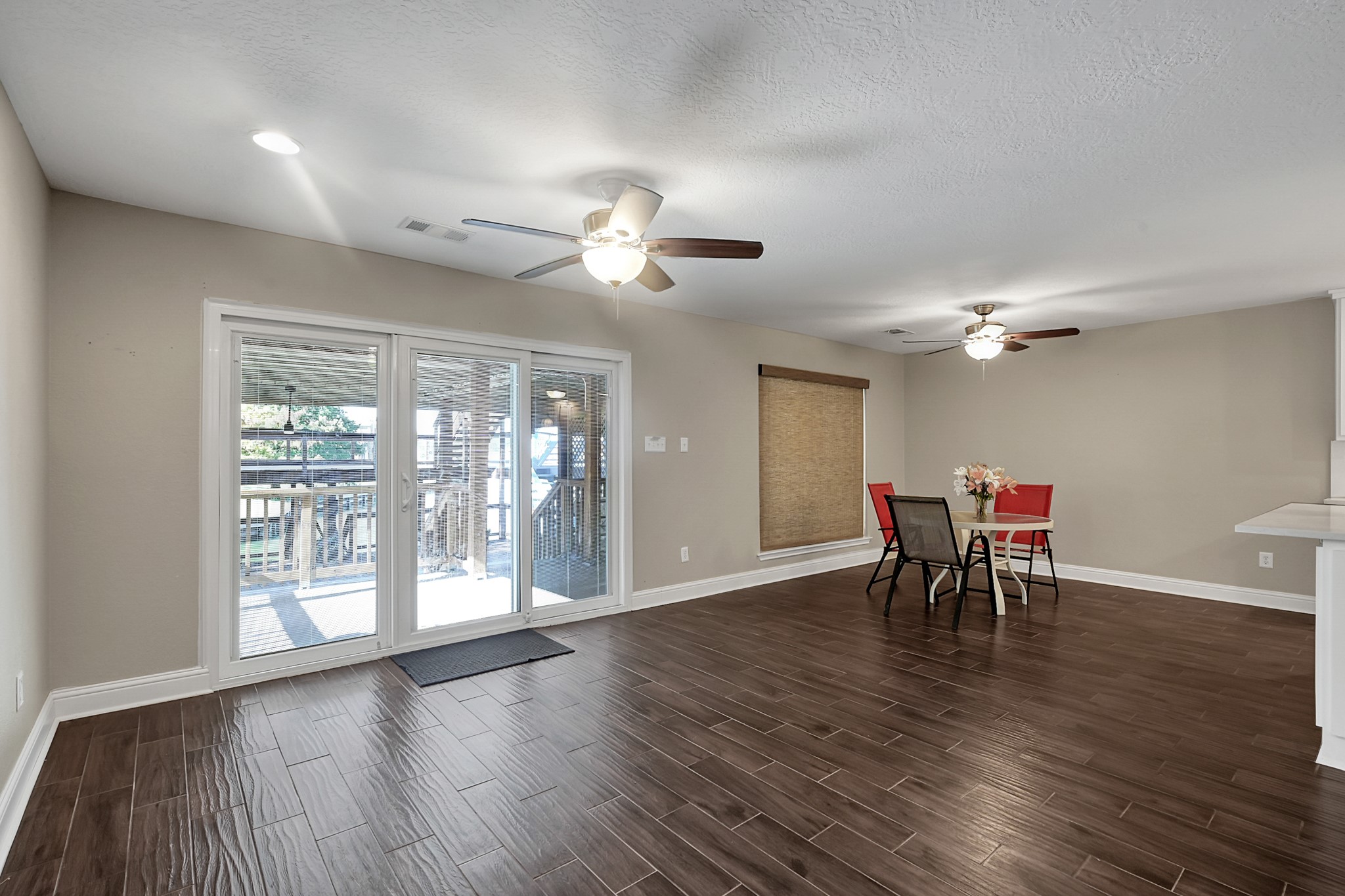 125 Capetown Street Conroe, TX 77356 - Photo 6 of 23 a view of a dining room with furniture window and wooden floor