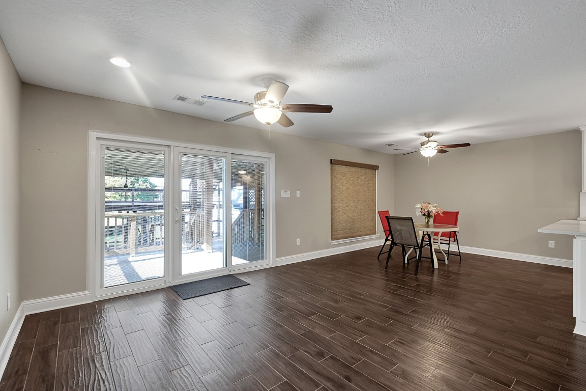 125 Capetown Street Conroe, TX 77356 - Photo 6 of 23 a view of a dining room with furniture window and wooden floor