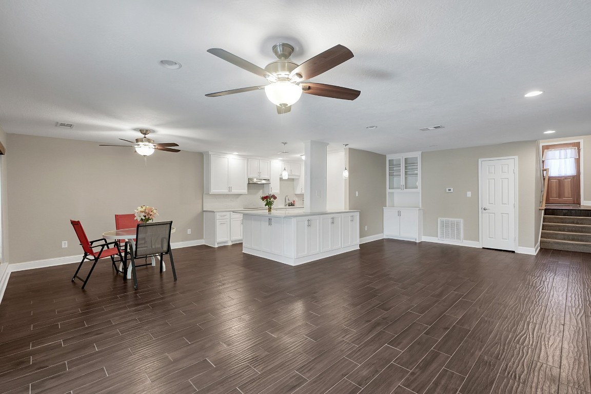 125 Capetown Street Conroe, TX 77356 - Photo 7 of 23 a view of a dining room with furniture and wooden floor