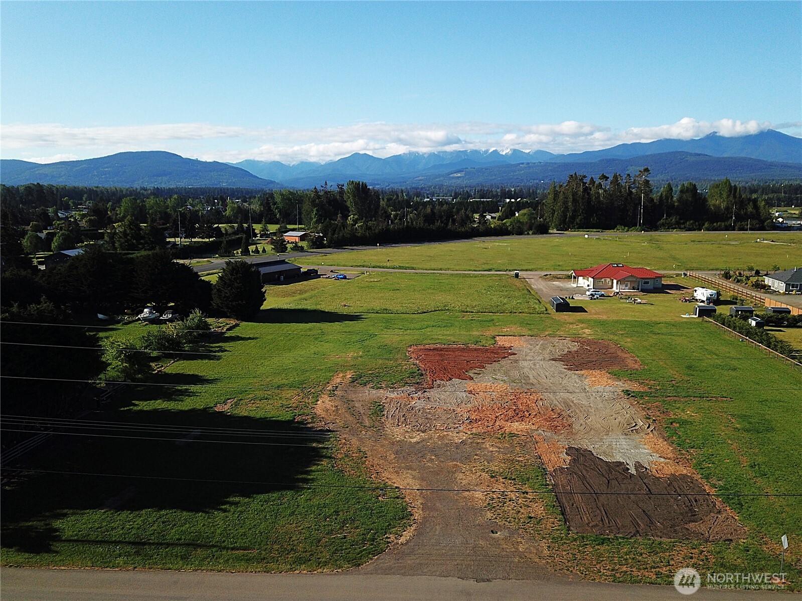 9999 Macleay Road Sequim, WA 98382 - Photo 5 of 16 a view of a lake with a mountain in the background