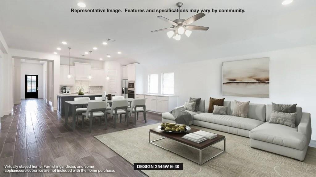 705 Running Iron Trail Mansfield, TX 76063 - Photo 2 of 6 a living room with furniture kitchen view and a dining table