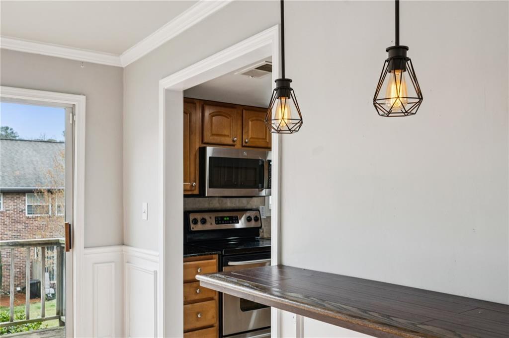 2825 Northeast Expressway, Unit O2 Atlanta, GA 30345 - Photo 12 of 27 a kitchen with a refrigerator and a stove