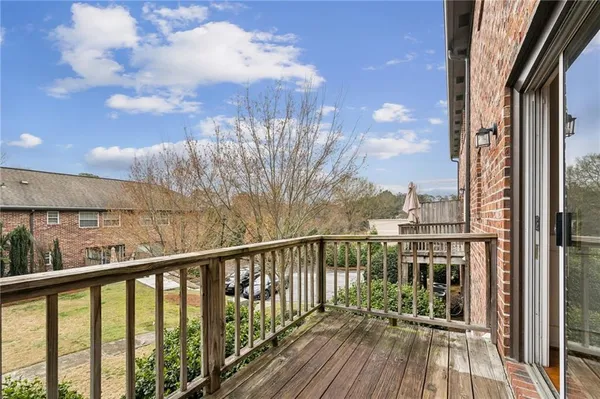 a view of a balcony with wooden floor