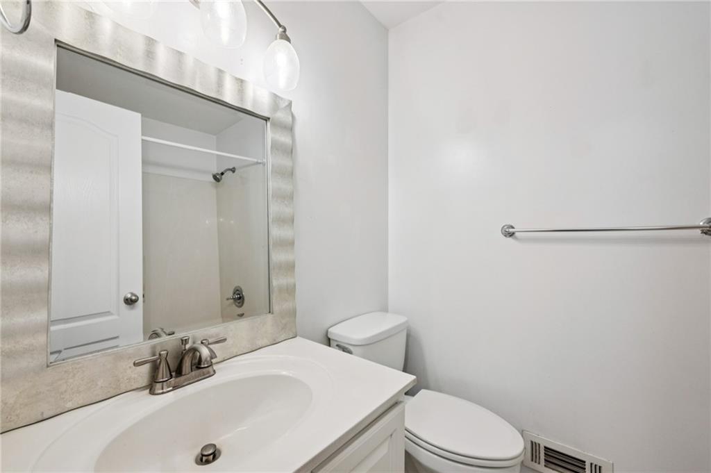 2825 Northeast Expressway, Unit O2 Atlanta, GA 30345 - Photo 20 of 27 a bathroom with a sink a toilet and shower