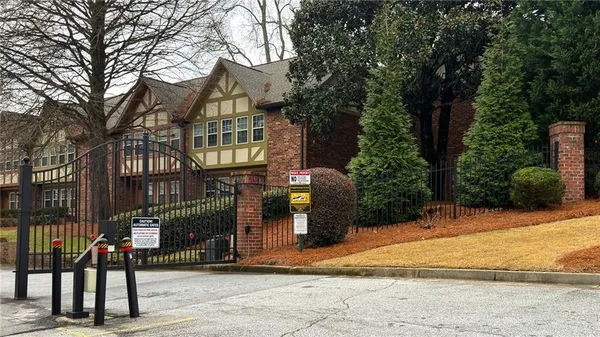 a view of a brick house with many windows