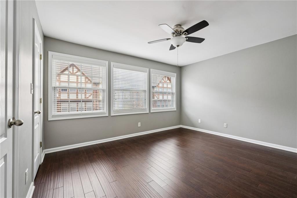 2825 Northeast Expressway, Unit O2 Atlanta, GA 30345 - Photo 23 of 27 an empty room with wooden floor fan and windows