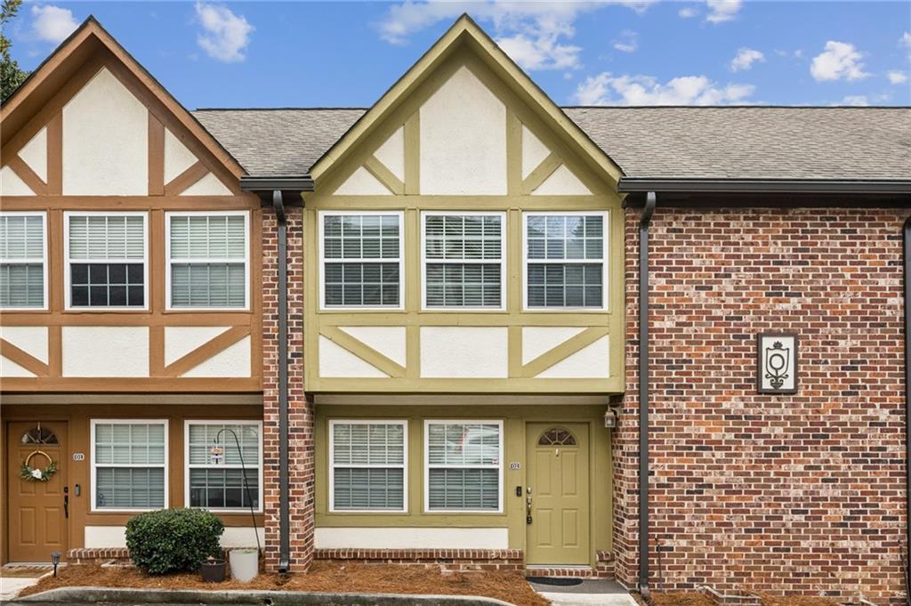 2825 Northeast Expressway, Unit O2 Atlanta, GA 30345 - Photo 4 of 27 front view of a brick house with a large windows
