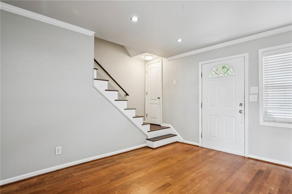 2825 Northeast Expressway, Unit O2 Atlanta, GA 30345 - Photo 6 of 27 a view of an empty room with wooden floor and stairs