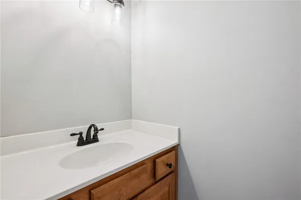 a bathroom with a sink and mirror