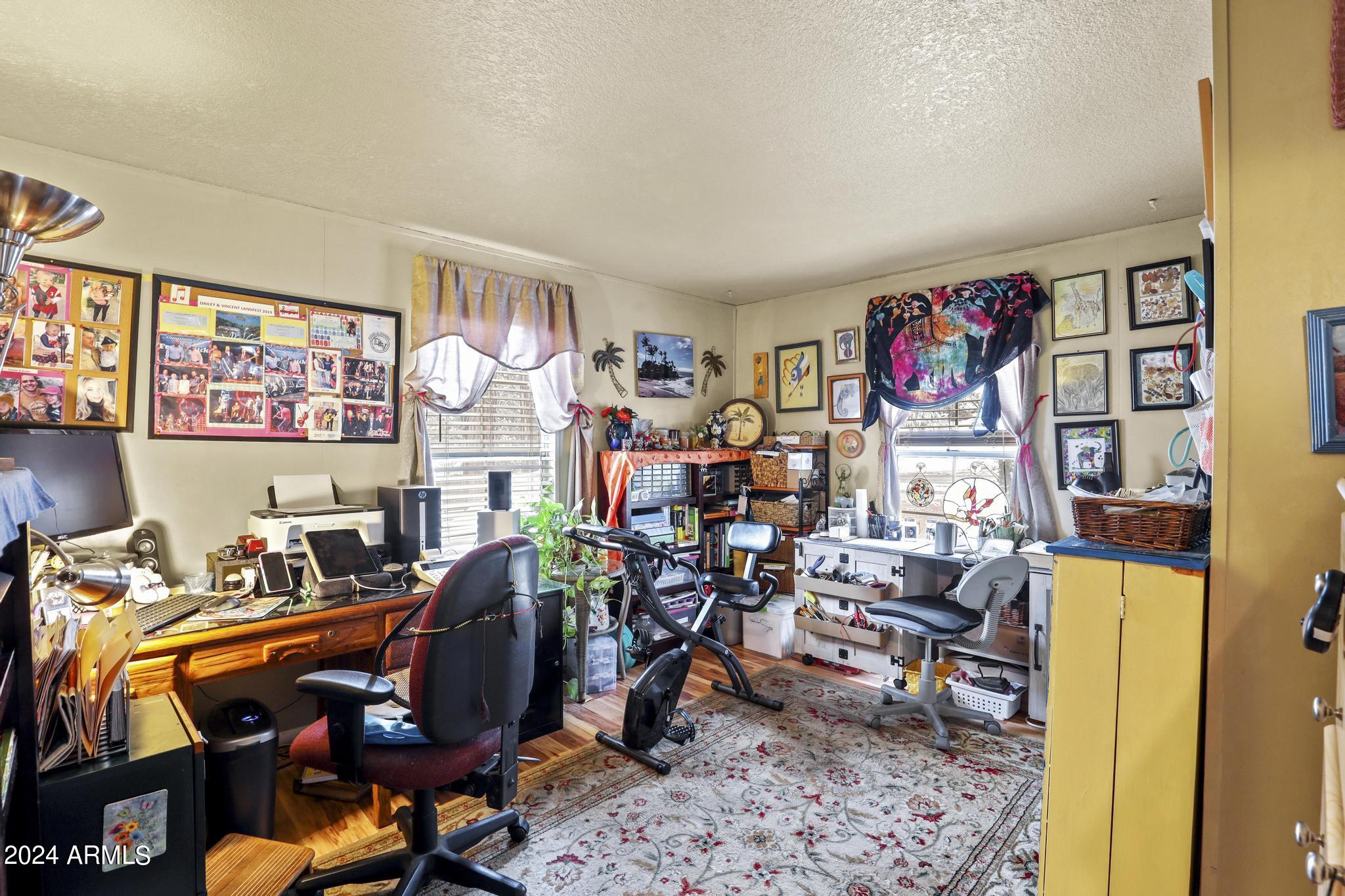 308 East Cherry Street Payson, AZ 85541 - Photo 14 of 22 a room with furniture a rug and a fan