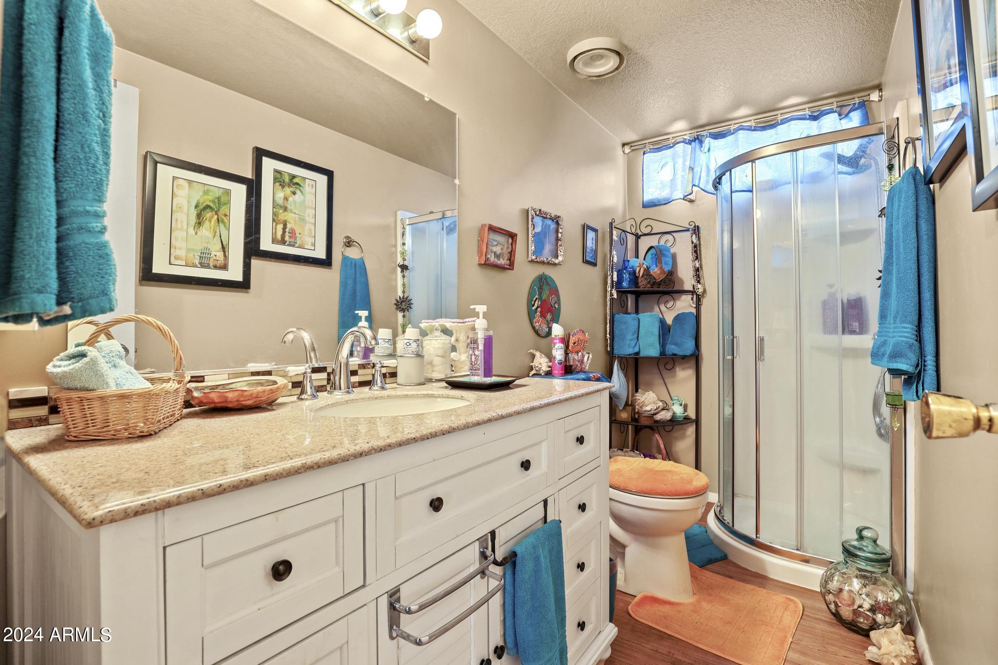 308 East Cherry Street Payson, AZ 85541 - Photo 16 of 22 a bathroom with a granite countertop sink and a mirror